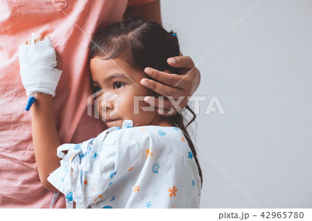 Sick asian little child girl hugging her mother 42965780