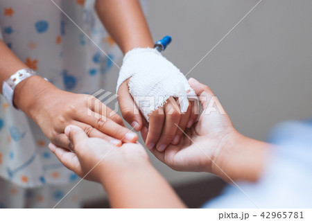 Child girl holding sick young sister hand 42965781