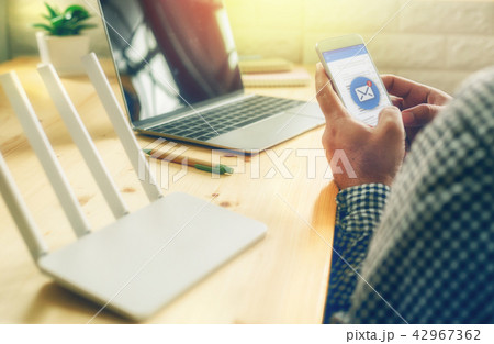 man hand using mobile phone with email application man hand using mobile phone with email application 42967362