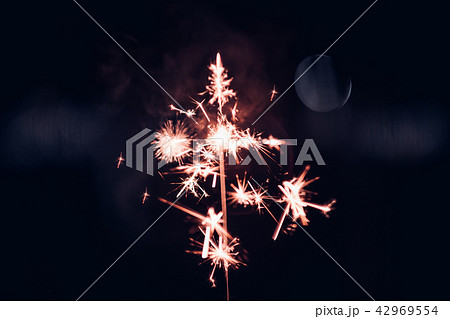 Hand holding burning Sparkler blast 42969554