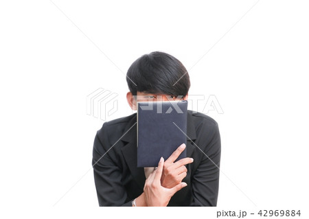 student holding book on white background student holding book on white background 42969884
