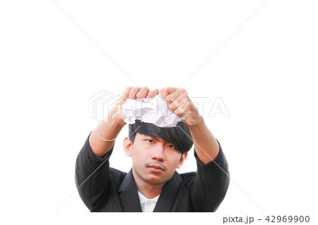 businessman tearing up a document on white 42969900