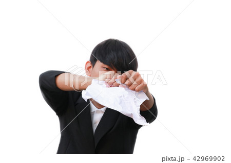 businessman tearing up a document on white  42969902