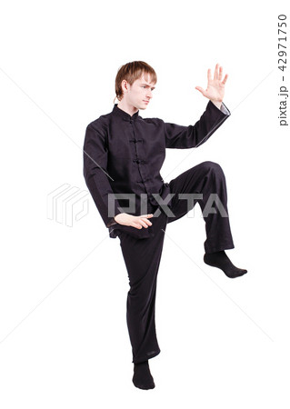 Man in a kimono practicing kung fu Man in a kimono practicing kung fu 42971750