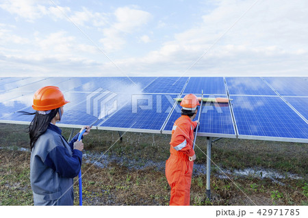 Engineers are checking the solar panel maintenance Engineers are checking the solar panel maintenance 42971785