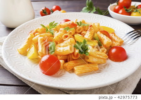 Macaroni, pasta in tomato sauce and cheese  42975773