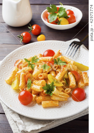 Macaroni, pasta in tomato sauce and cheese  42975774