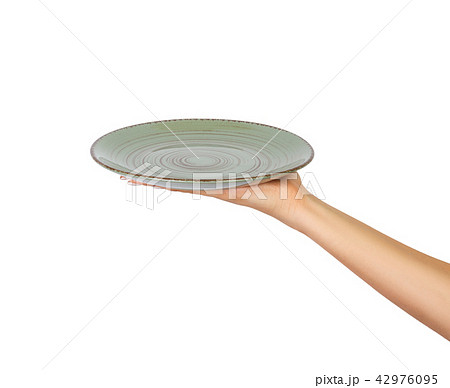 Hand holding empty plate isolated  42976095