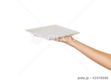 Hand holding empty plate isolated Hand holding empty plate isolated 42976096