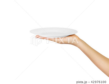 Hand holding empty plate isolated  42976100
