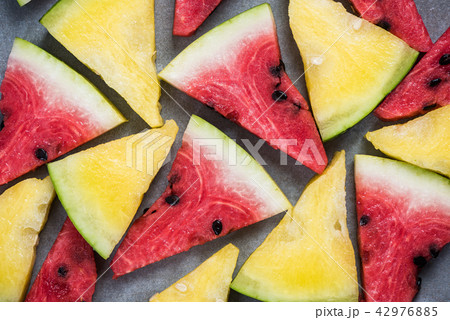 Red and yellow watermelon pieces Red and yellow watermelon pieces 42976885