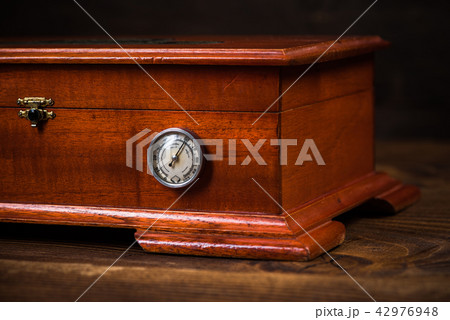 Wooden humidor for storage cigars Wooden humidor for storage cigars 42976948
