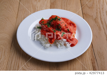 Meatballs with rice on wooden table 42977413