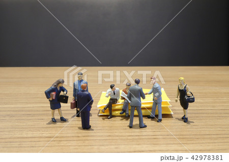 a mini figure of Business standing with team. a mini figure of Business standing with team. 42978381