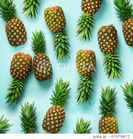 Square crop. Fresh pineapples on blue background 42979872