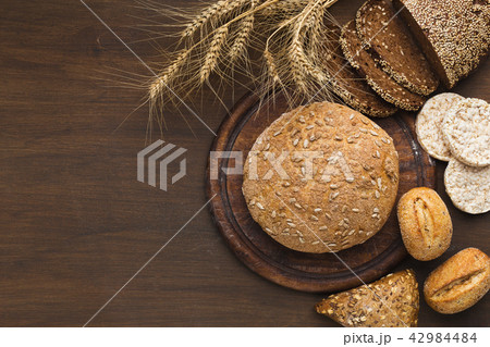 Many healthy gluten free bread on wooden table 42984484