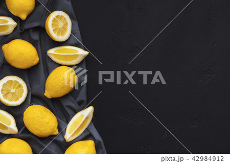 Fresh lemons on black background Fresh lemons on black background 42984912