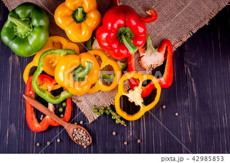 Three sweet peppers on a wooden  42985853