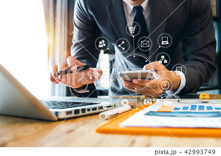 close up of businessman working with smart phone  42993749