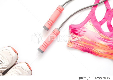 Sporty woman clothing and equipment on white 42997645