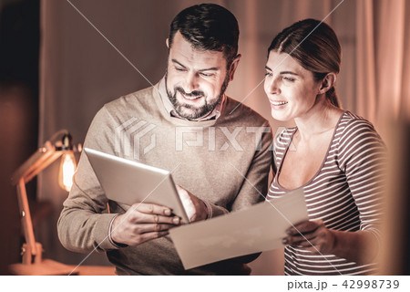 Cheerful managers comparing reports 42998739