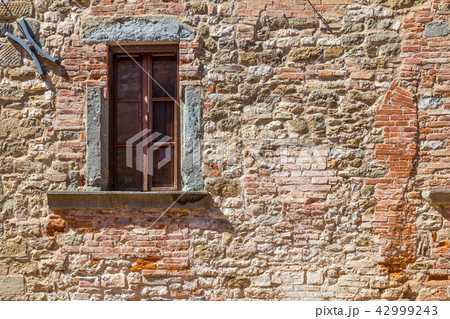 Window on medieval stone 42999243