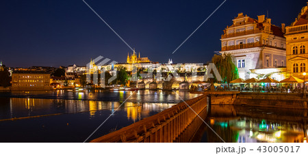 Prague by night. Prague Castle and Charles Bridge reflected in Vltava River. View from Smetana Prague by night. Prague Castle and Charles Bridge reflected in Vltava River. View from Smetana 43005017