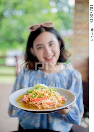 Young asain girl holding papa salad Young asain girl holding papa salad 43007781