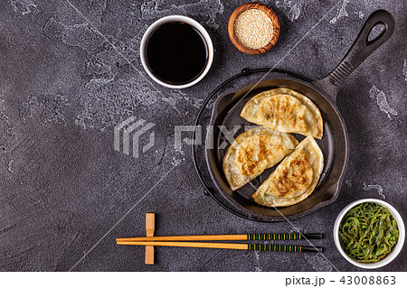 Gyoza or dumplings snack with soy sauce. Gyoza or dumplings snack with soy sauce. 43008863