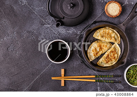 Gyoza or dumplings snack with soy sauce. Gyoza or dumplings snack with soy sauce. 43008864