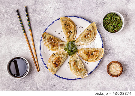 Gyoza or dumplings snack with soy sauce. Gyoza or dumplings snack with soy sauce. 43008874