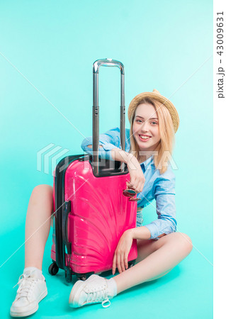 beautiful holiday-maker with pink baggage 43009631