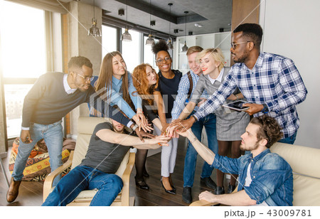 united multi ethnic youth putting hands together united multi ethnic youth putting hands together 43009781