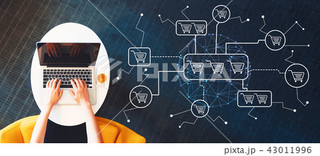 Online shopping theme with person using a laptop Online shopping theme with person using a laptop 43011996