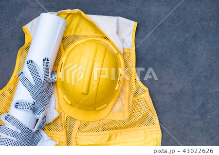 Yellow safety helmet with glove, blueprint 43022626