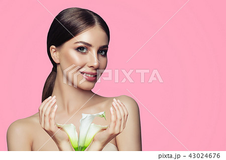 Spa woman with healthy skin, manicured hands Spa woman with healthy skin, manicured hands 43024676