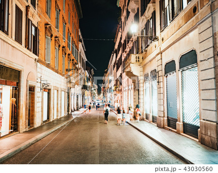 Typical italian street at night in the centre of the Old Town. Rome, Italy. Lot of illuminated Typical italian street at night in the centre of the Old Town. Rome, Italy. Lot of illuminated 43030560