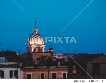 Beautiful night aerial view of Piazza Spagna - Rome, Italy. Dome of cathedral on blue sky background 43030561