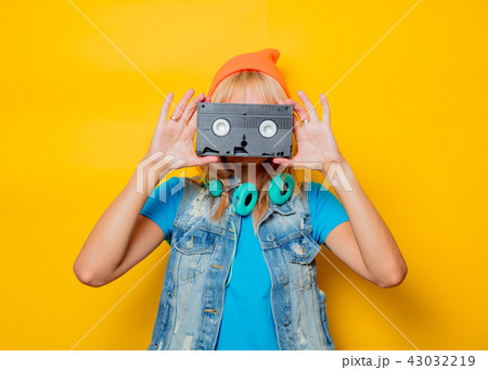 adult girl orange hat with VHS 43032219
