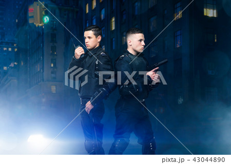 Special force poses with gun and transmitter 43044890