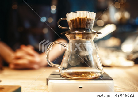 Glass coffee pot stands on stove closeup, nobody Glass coffee pot stands on stove closeup, nobody 43046032