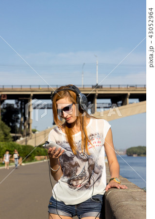 Young women rollerblading with music Young women rollerblading with music 43052964
