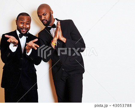 two afro-american businessmen in black suits emotional posing, g 43053788