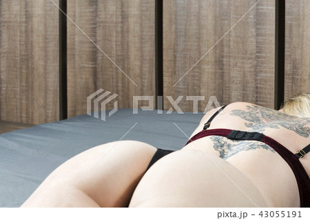 Woman ass on the bed 43055191