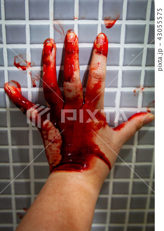Hand of depressed woman covered with fresh blood Hand of depressed woman covered with fresh blood 43055575