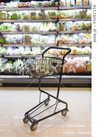 A shopping cart in supermarket with variety of veg A shopping cart in supermarket with variety of veg 43062156