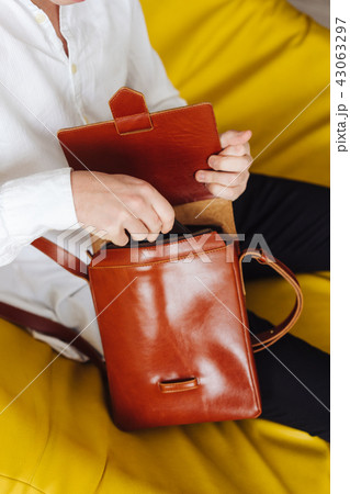 handsome guy with leather bag handsome guy with leather bag 43063297