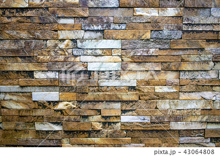 たくさんの種類の岩でできた壁のテクスチャの写真素材