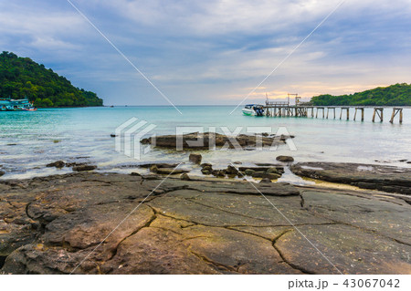 Wooden sea bridge to bay sunset sky with cloud 43067042
