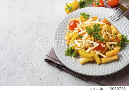 Macaroni, pasta in tomato sauce and cheese Macaroni, pasta in tomato sauce and cheese 43070796